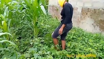 Blonde Mom Inspects Her Student'S Maize Crop In The College Garden