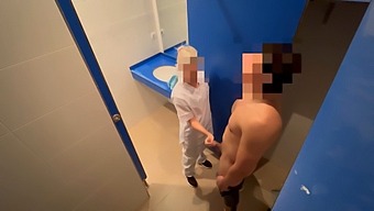 A Man Jerks Off In The Gym Toilet While A Cleaning Girl Catches Him And Gives Him A Blowjob